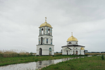 Classic orthodox village church with natural rainy background