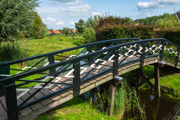 A small wooden bridge over a canal in Zaanse Schans / Netherlands