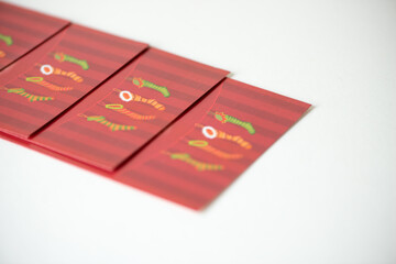 old, vintage christmas cards of stockings (in red) photographed on white using a macro lens (shallow depth of field)