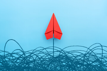 Business for solution concept. Red paper plane on blue background
