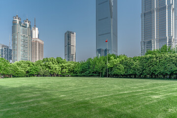 Lujiazui central park, green grass and modern skycrapers,  for background.