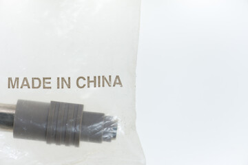 computer cable connector adapter sealed in a translucent plastic bag with MADE IN CHINA printed in...