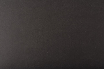 Dark black rough background. Black board. Black textured background with copy space. Grungy black table top view