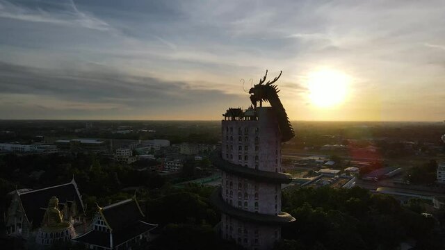 Aerial view from drone footage above the dragon temple called Wat Sampran in Nakhon Phathom, Thailand.