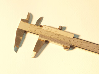 Vernier caliper in white background.