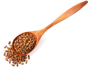 Barley Tea in the wooden spoon, isolated on white background, top view