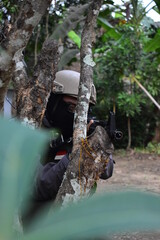 soldier behind the tree