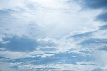 blue sky , White clouds floating on sky and sun shines through the clouds. for backgrounds concept.