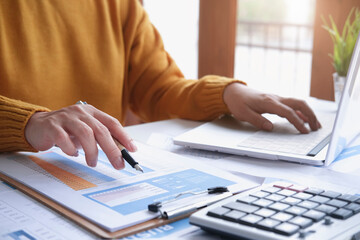 Office workplace with business finance, accounting,laptop on wood table.finance statistics and analytic research concept