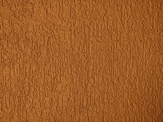 Abstract rough wall texture plaster brown color. Grunge scratched surface background.
