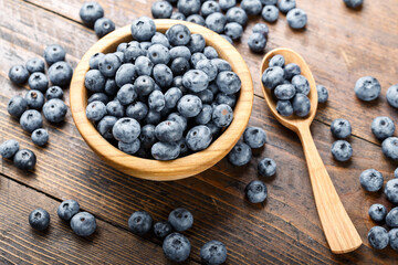 Juicy and fresh blueberries on a rustic table. Vegan and vegetarian concept.