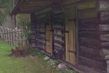 Old wooden farm. Rural landscape. The open air Museum in Tallinn. Retro toned.