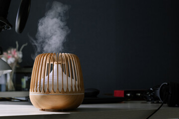 Stylish aroma oil diffuser humidifies the air by releasing steam. Comfortable home environment.