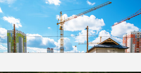 Long white hoarding with space for mockup on fence against construction site