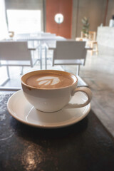 Latte art on hot milk coffee