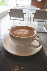 Latte art on hot milk coffee