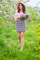 Beautiful natural woman in the garden of apple