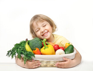 Eco fresh grown food concept.Child holding basket with organic fruits and vegetables. Healthy kid's nutrition.
