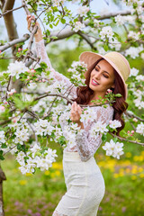 Beautiful natural woman in the garden of apple