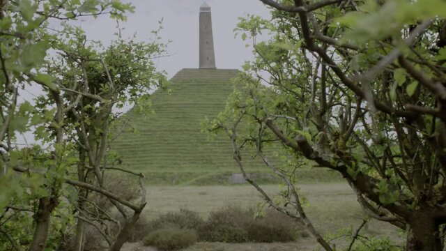 revealing the historical Pyramid of Austerlitz in the Netherlands through the bush.