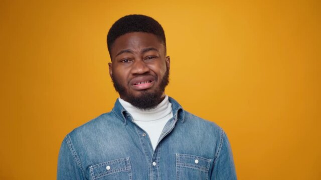 Young bearded african man expressing disgust and aversion