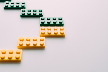 Plastic building blocks on white background