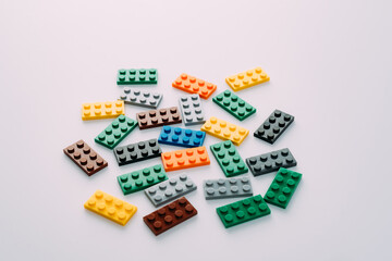 Plastic building blocks on white background
