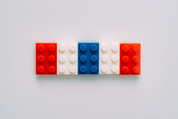 Plastic building blocks on white background