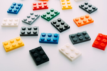 Plastic building blocks on white background
