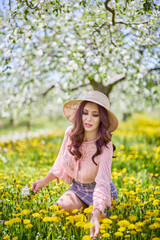 Beautiful natural woman in the garden of apple