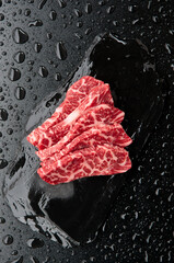 Raw wagyu beef in black background