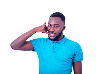 handsome young man making cell phone gesture with hands.