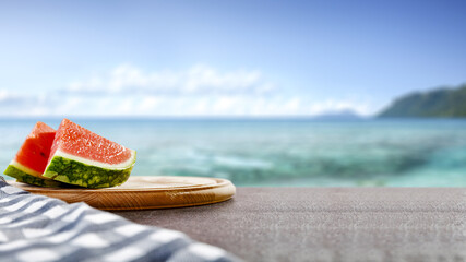 Watermelon on desk and summer beach 