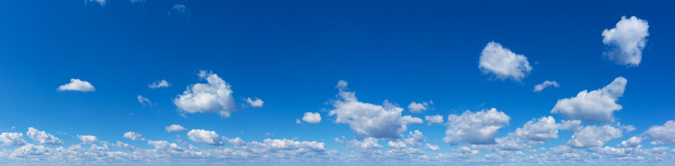 Blue Sky background with tiny Clouds. Panorama background