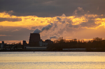 Industry in a city by the river. Ecological concept.