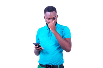 young man holding a cellphone and holding his breath with the fingers on his nose.