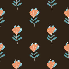 Abstract orange colored scribble flower silhouettes seamless pattern. Black background.