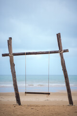 Obraz premium Swings on the sand tropical beach.