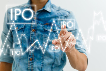 Businessman hand touching IPO or Initial Public Offering sign on virtual screen.