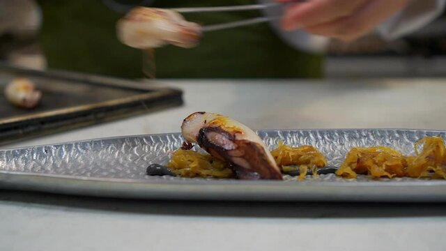 Squid with caramelized onion with squid ink sauce