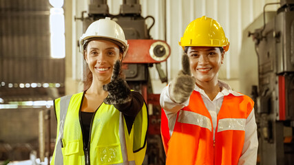 African female workers American and Asian female workers Confidently standing with arms crossed in the factory