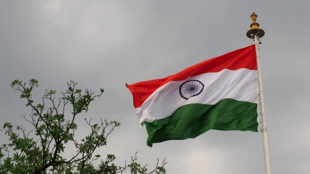INDIA FLAG FLYING HIGH WITH PRIDE, india flag fluttering, india independence day and republic day of india, tilt up shot