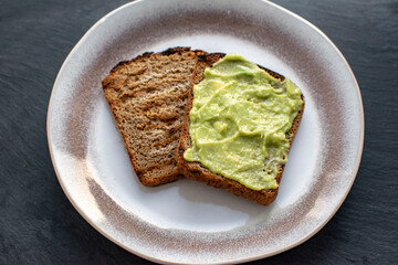 Sandwiches with scrambled eggs and guacamole. Gastronomic concept.