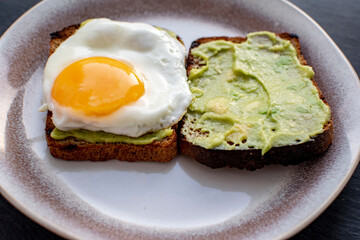 Sandwiches with scrambled eggs and guacamole. Gastronomic concept.