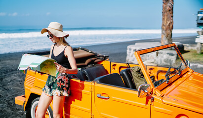 Young woman looking at map © BullRun