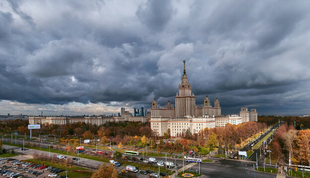 Aerial panoramic view of sunset  campus buildings of famous Moscow university under dramatic cloudy sky in autumn