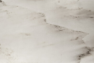 Polished marble element with veins and splashes