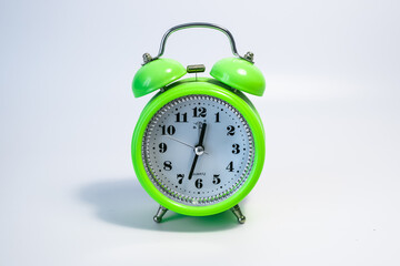 Close-up colorful clock. Colorful clock with white background. Old-style decorative clock.