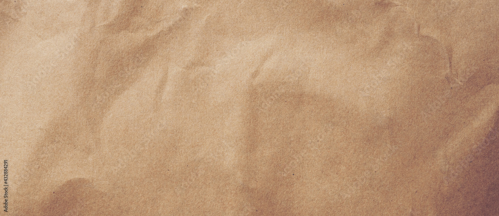 Wall mural close up crumpled brown paper texture and background with copy space