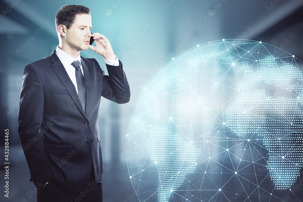 Poster businessman talking on the phone in an office with big windows and a holographic globe in the backgr